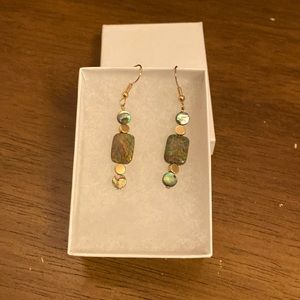 Gold tone dangle earrings with beautiful color stones.